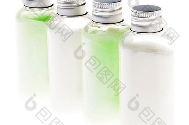 小透明的塑料瓶填满化妆品粉绿色白色乳液密封银金属帽绿色内容瓶