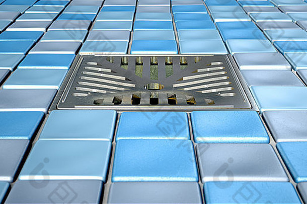 一个淋浴地板，装饰着蓝调的小方形浴室马赛克和中间设置的铬排水管。