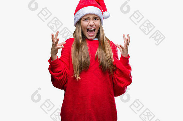 年轻漂亮的女孩戴着圣诞帽在孤立的背景下疯狂地<strong>叫</strong>喊着，表情咄咄人，双臂高举。Fru