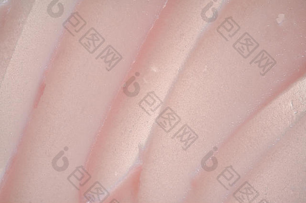 精致的粉红色纹理和白色背景上化妆面膜或面霜的笔触