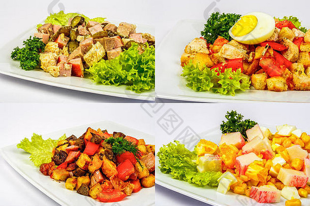 四份沙拉，配肉、西红柿、蟹条、饼干、黄瓜、玉米和鸡蛋，放在白色盘子上，作为庆祝桌