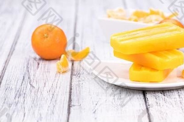 自制的橘子冰棍新鲜的水果特写镜头拍摄古董背景