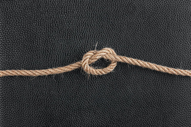 绳结位于天然皮革上，可用作背景
