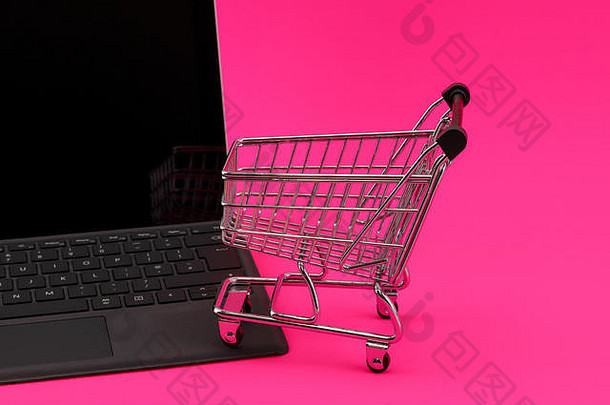 互联网购物概念移动PC电脑迷你购物车篮子休息键盘孤立的粉红色的背景