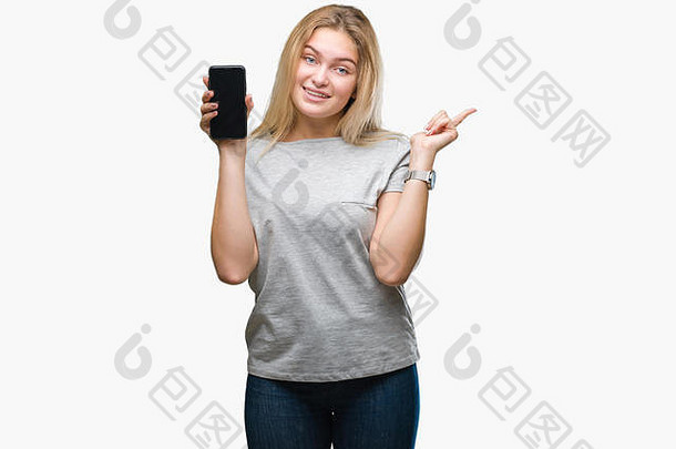 年轻的高加索人女人显示<strong>屏幕</strong>智能手机孤立的背景快乐指出手手指一边