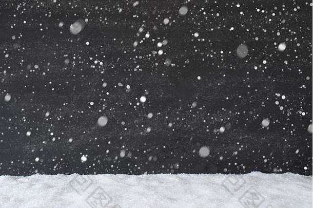 黑色的水泥墙雪背景纹理雪花