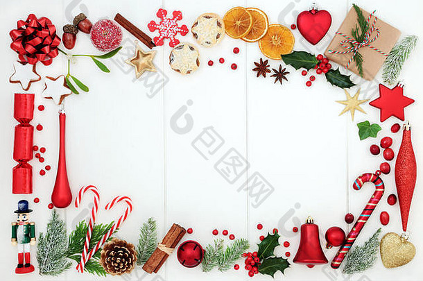 圣诞节背景边境传统的符号小玩意装饰薄脚水果糖果拐杖香料冬天植物区系礼物盒子锈
