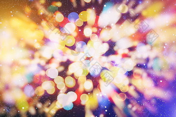 闪闪发光的灯泡背景灯：模糊的圣诞墙纸装饰概念。节日背景：闪亮的圆形灯光