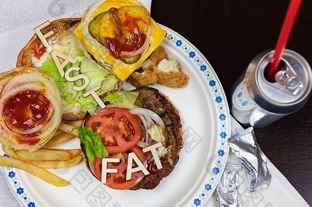 脂肪信多汁的汉堡不健康的吃垃圾食物概念