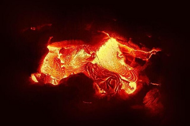 详细的视图活跃的熔岩流热岩浆出现裂纹地球发光的熔岩出现强大的黄色红色位置山楂