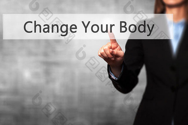 改变你的身体-女商人手按触摸屏界面上的按钮。商业、技术、互联网概念。库存照片