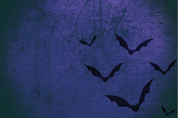 蓝色纹理背景上的黑色蝙蝠万圣节