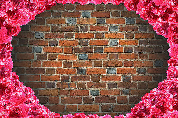 红玫瑰框架和红砖墙背景