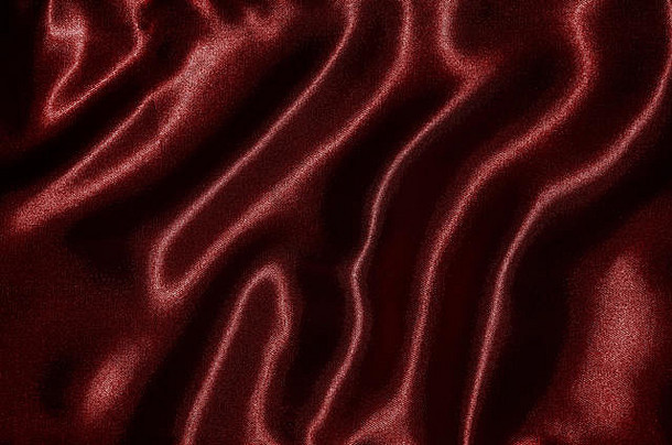 红色织物的抽象背景，红色织物的壁纸和纹理，条纹织物的顶视图和波浪。