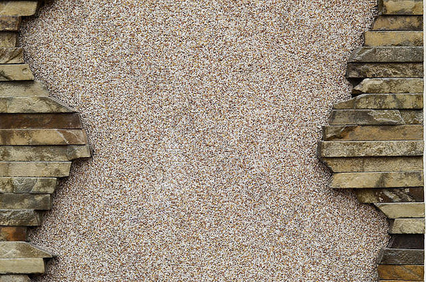 灰泥和过的米色混凝土墙，有一个漂亮的扁矩形石头框架。采购带有hu的幻灯片、演示文稿或表格