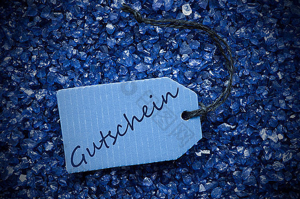 带有标签Gutschein的紫色石头表示<strong>代金券</strong>