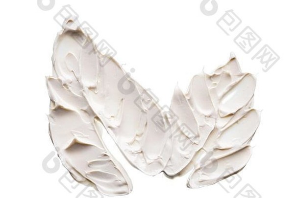 白色的污渍和质地，由隔离在白色背景上的面部粘土或奶油制成。