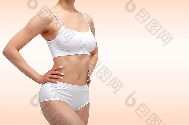 苗条的纤细的女人白色内衣摆姿势白色背景健康身体护理概念健康的生活方式