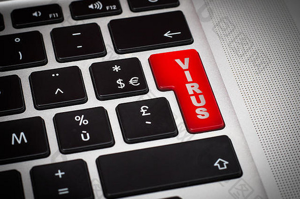 键盘特写上带有病毒字的红色按钮。