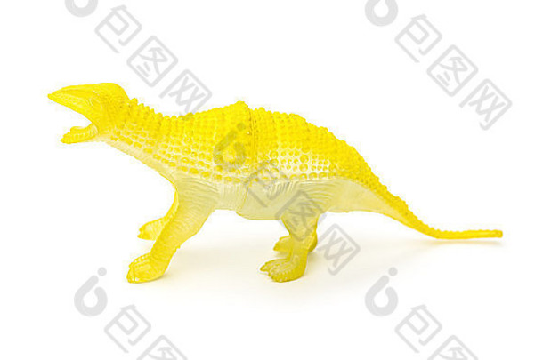 一边视图黄色的塑料<strong>恐龙玩具</strong>白色背景
