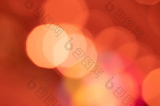 橙色灯光背景-带有高光的抽象纹理。彩色圆形模糊亮光