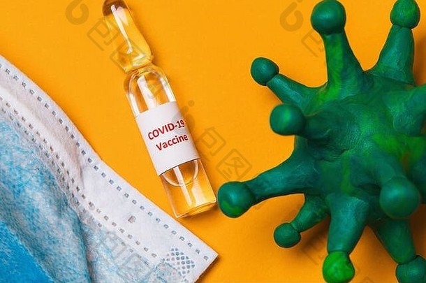科维德冠状病毒疫苗医疗面具黄色的背景前视图流感大流行病毒治疗概念