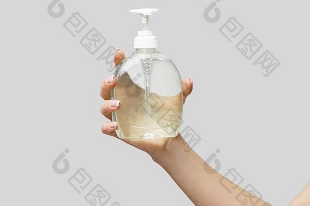 女手手洗手液过来这里液体肥皂自动售货机光灰色背景