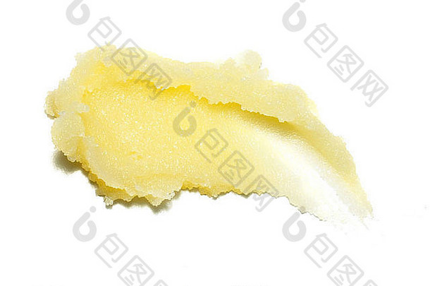 米黄色身体磨砂膏，剪在白色背景上