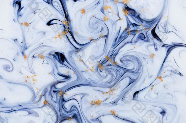 大理石花纹独特的蓝色抽象背景，带有金粉