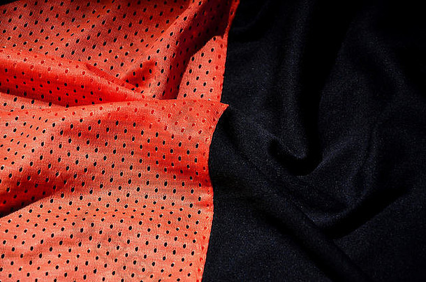 红色的体育运动服装织物纹理背景前视图红色的布纺织表面明亮的篮球衬衫文本空间
