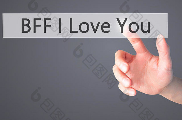 BFF我爱你-手按一个模糊的背景概念按钮。商业、技术、互联网概念。库存照片