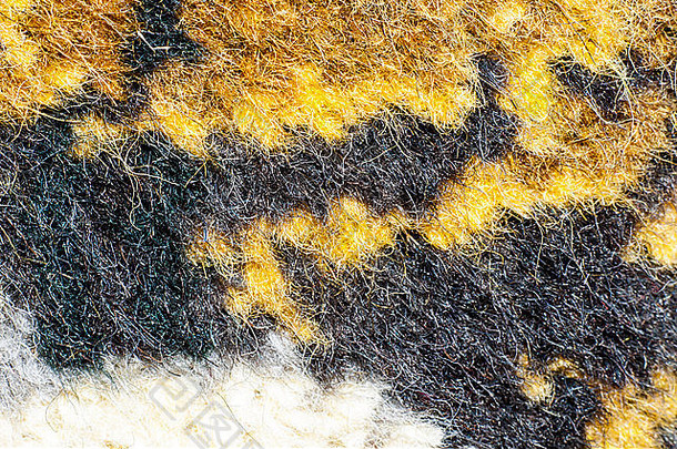 地毯图案的碎片是由天然羊毛制成的