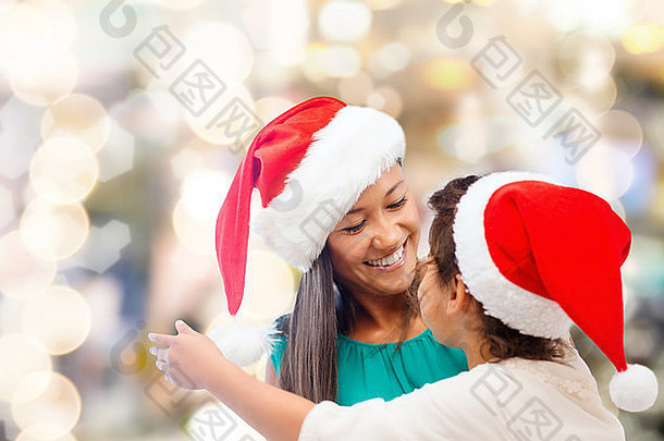 戴<strong>圣诞</strong>帽的快乐妈妈和女孩