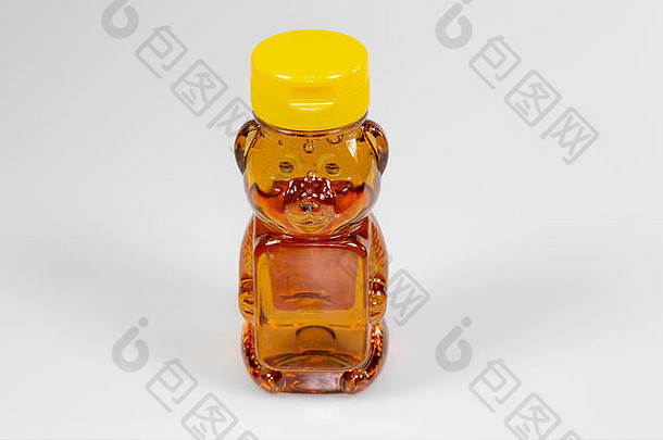 一个熊形的塑料瓶，装满了等待使用的蜂蜜