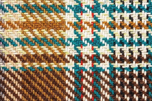棕色（的）网纹织物彩色的线程苏格兰羊毛织物格子外套西装特写镜头背景