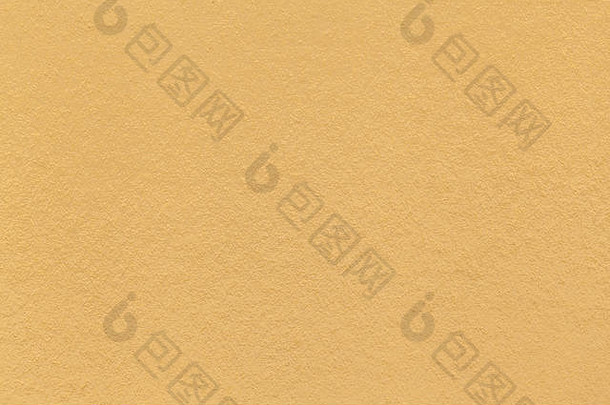 旧浅黄色纸张特写的纹理。厚纸板的结构。金色背景。