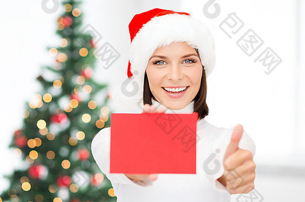戴着圣诞老人助手帽、红牌空白的女人