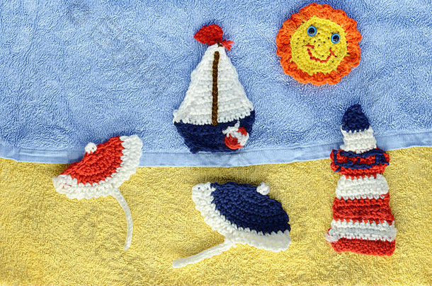 海滩场景用钩针编织太阳航行船光房子阳伞毛巾背景塔维尔酒