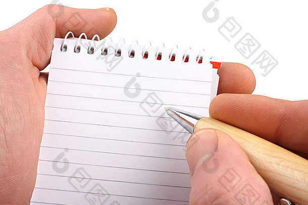 在孤立的白色背景上用圆珠笔记事本的手。