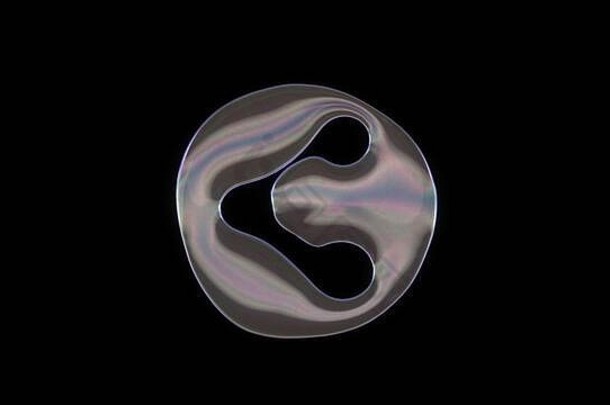 呈现扭曲的透明的肥皂泡沫形状象征圆网络孤立的黑色的背景
