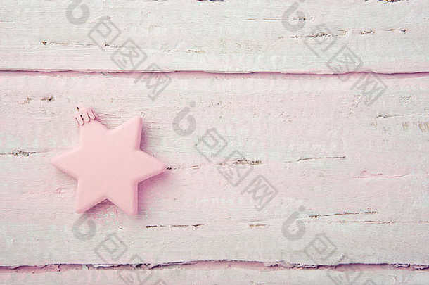 一年的圣诞节玩具明星美丽的木粉红色的表格