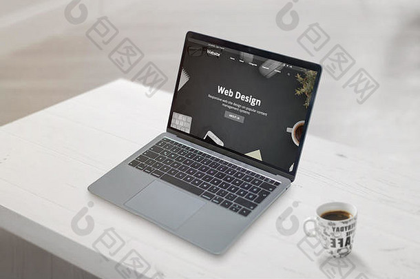 笔记本电脑上的Web design studio概念网页。清洁现场，旁边放一杯咖啡。Web开发或设计工作室概念。