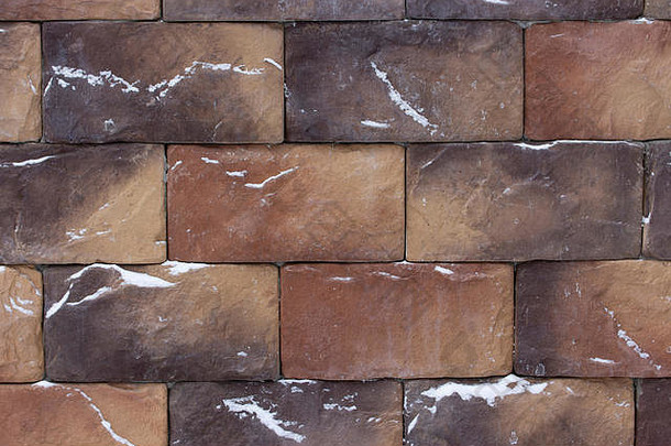 美丽的棕色（的）棕色（的）石头砖背景纹理溅雪变形材料建设外墙建筑冬天