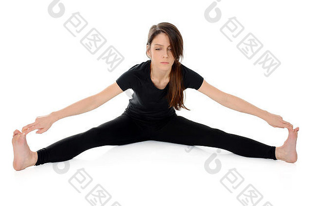 年轻女子做瑜伽体式-仰卧式-广角坐姿前弯