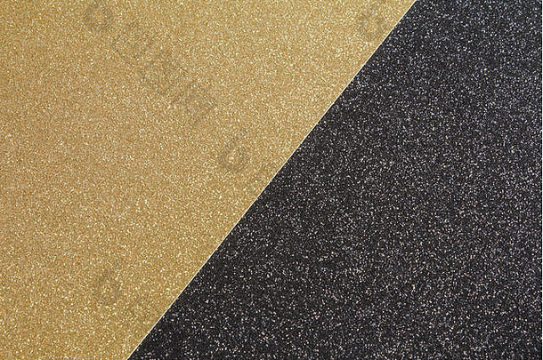 金色工艺闪光纸和黑色工艺闪光纸相邻放置，形成黑色和金色背景。