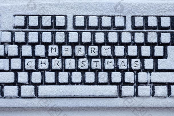 电脑键盘覆盖白色雪登记快乐圣诞节