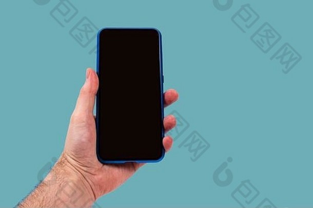 智能手机人类手蓝色的背景