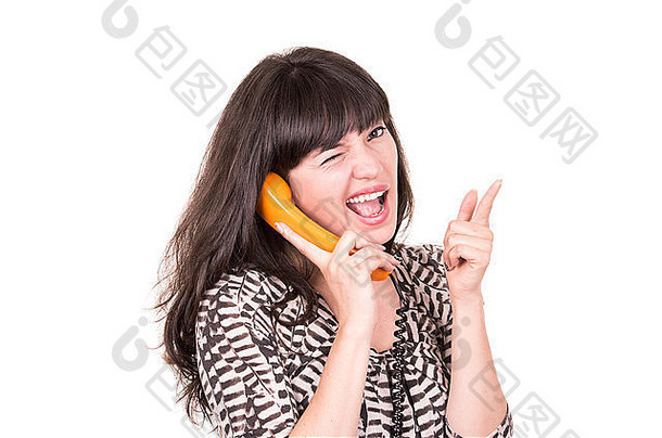 美丽的年轻的女人复古的橙色电话