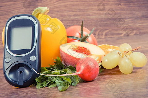 11月14日是世界糖尿病日的标志，血糖仪用于测量血糖水平和水果与蔬菜，对抗疾病的概念