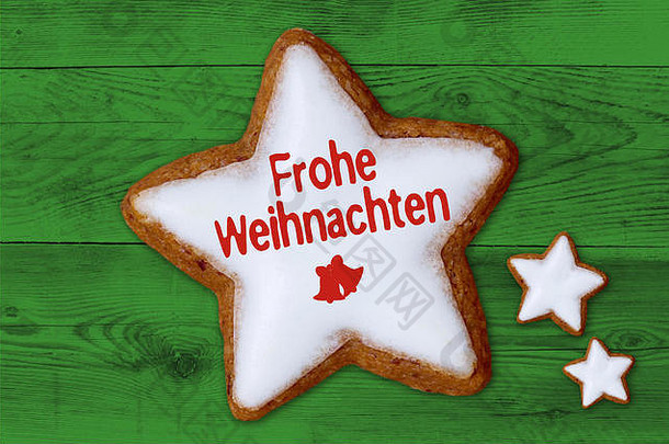 喜圣诞节德国快乐圣诞节肉桂明星绿色木背景